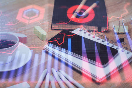 Double exposure of forex chart drawing and cell phone background. Concept of financial tradingの写真素材