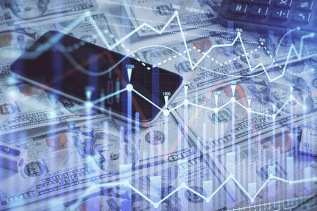 Double exposure of forex graph drawing over us dollars bill background. Concept of financial...