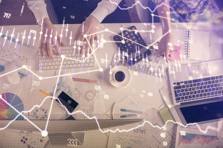 Double exposure of man and woman working together and financial chart hologram drawing. market...