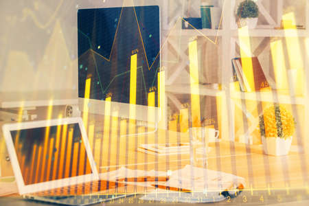 Stock market graph and table with computer background. Multi exposure. Concept of financial...