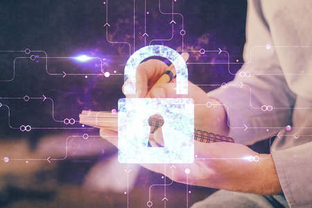 Humans hands with cyber security theme multi exposure background drawings. Concept of online protection.の写真素材