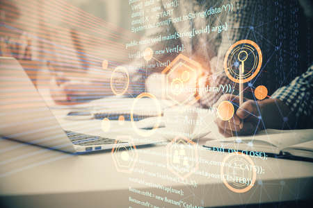 Businessman with computer background with technology theme hologram. Concept of hightech. Multi...