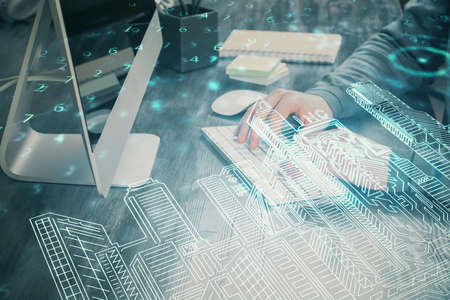 High tech city drawing with businessman working on computer on background. Smartcity concept. Double...
