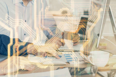 Technology theme hologram with man working on computer on background. High tech concept. Multi exposure.の写真素材