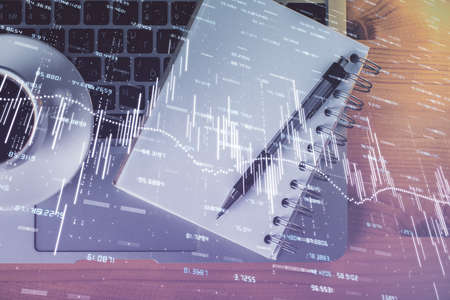 Multi exposure of forex chart drawing and work table top view. Concept of financial analysis.