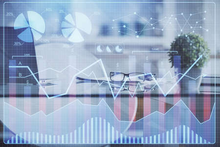 Double exposure of financial graph drawing and office interior background. Concept of stock market.