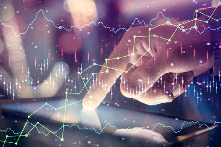 Multi exposure of mans hands holding and using a phone and financial chart drawing. Market analysis...