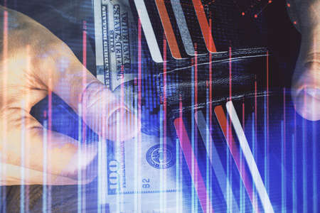 Multi exposure of forex graph drawing hologram and USA dollars bills and man hands. Technical...
