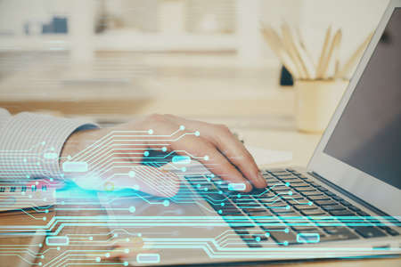 A man working on Laptop with technology theme drawing. Concept of big data. Double exposure.の写真素材