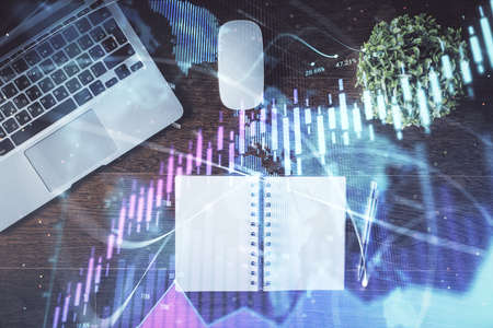 Stock market graph and top view computer on the table background. Double exposure. Concept of...