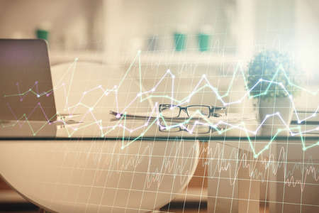 Double exposure of financial graph drawing and office interior background. Concept of stock market.の写真素材