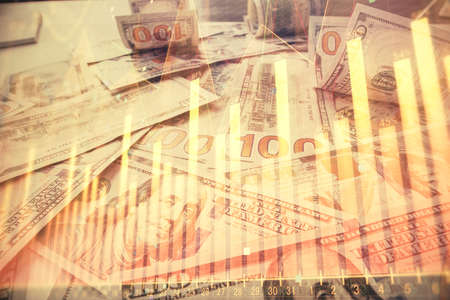 Multi exposure of forex chart drawing over us dollars bill background. Concept of financial success...