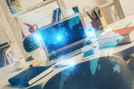 Computer on desktop with social network hologram. Multi exposure. Concept of international people...