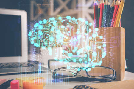 Brain drawings with glasses on the table background. Double exposure.の写真素材