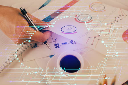 Writing mans hands background with technology huds. Double exposure. Concept data.の写真素材