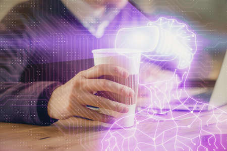 AR hologram with man working on computer on background. Augmented reality concept. Double exposure.