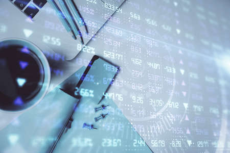 Double exposure of forex graph drawing over desktop background with computer. Concept of financial...