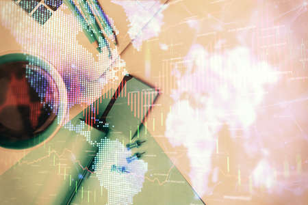 Double exposure of forex graph drawing over desktop background with computer. Concept of financial...