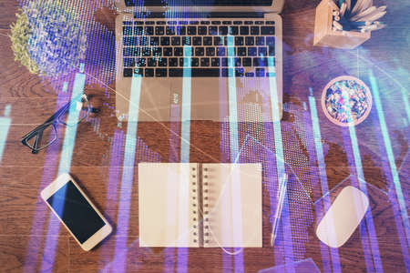Stock market graph and top view computer on the table background. Multi exposure. Concept of...