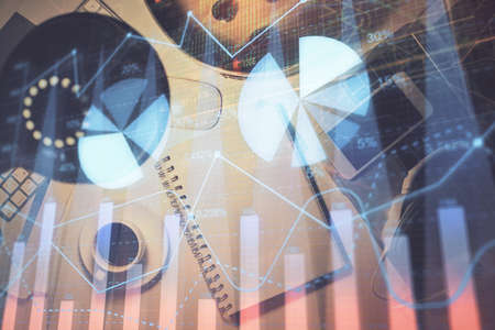 Multi exposure of forex chart drawing and work table top veiw. Concept of financial analysis.の写真素材