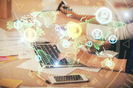 Multi exposure of woman hands typing on computer and financial chart hologram drawing. Stock market...