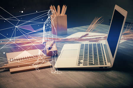Desktop computer background in office and start up theme hologram drawing. Double exposure. Startup...
