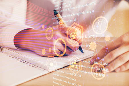Writing mans hands background with technology drawings. Double exposure. Concept of innovation.