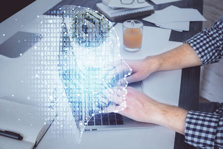 Man with computer background with brain theme hologram. Concept of brainstorm. Double exposure.