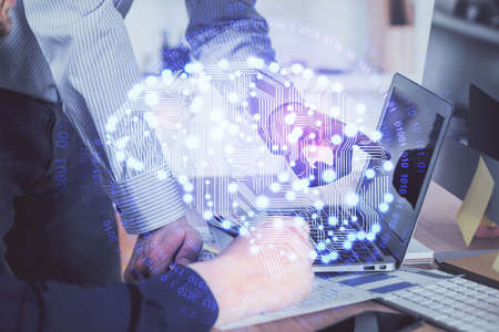 Man with computer background with brain theme hologram. Concept of brainstorm. Double exposure.