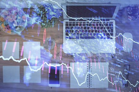 Stock market graph and top view computer on the table background. Multi exposure. Concept of...