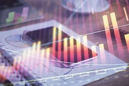 Double exposure of forex chart drawing and cell phone background. Concept of financial data analysis