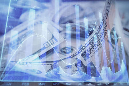 Double exposure of forex graph drawing over us dollars bill background. Concept of financial markets.の写真素材