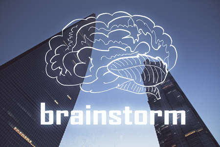 Double exposure of start up theme drawings over cityscape background. Concept of success.