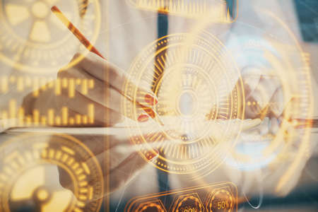 Technology theme hologram over womans hands taking notes background. Concept of Tech. Double...