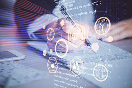 Double exposure of writing hand on background with data technology hologram. Big data concept.の写真素材
