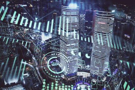 Double exposure of technology theme hologram and cityscape background. Concept of Hightech.の写真素材