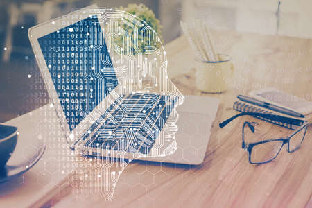 Double exposure of desktop with computer and brain drawing hologram. Artificial intelligence...
