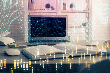 Financial chart drawing and table with computer on background. Double exposure. Concept of...