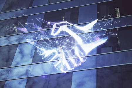 Double exposure of handshake hologram over city view background. Concept of partnership.