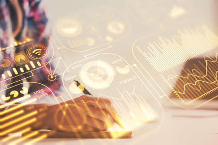 Technology theme hologram over womans hands taking notes background. Concept of Tech. Double...