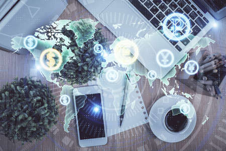 Multi exposure of financial chart hologram over desktop with phone. Top view. Mobile trade platform...