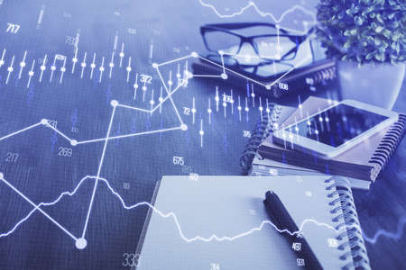 Double exposure of forex chart drawing and cell phone background. Concept of financial trading