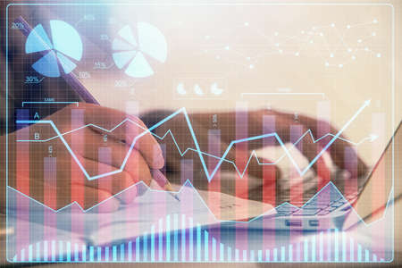 Double exposure of businesswoman hands typing on computer and forex chart hologram drawing....