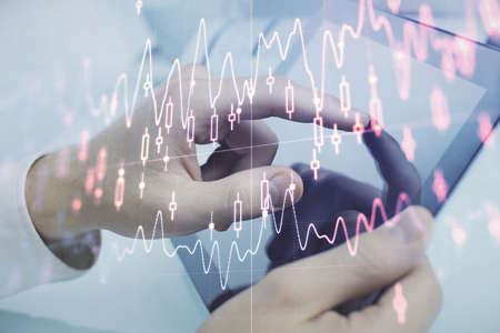 Multi exposure of mans hands holding and using a phone and financial chart drawing. Market analysis concept.の写真素材