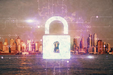 Lock icon hologram on city view with skyscrapers background multi exposure. Data security concept.