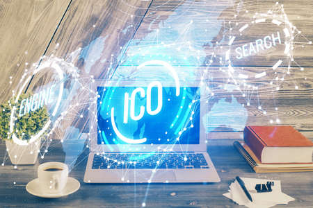 Double exposure of blockchain theme hologram and table with computer background. Concept of bitcoin...