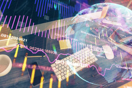 Double exposure of forex graph and work space with computer. Concept of international online...