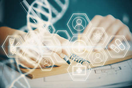DNA theme hologram over womans hands writing background. Concept of education. Double exposure