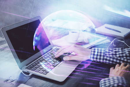 Technology theme hologram with man working on computer on background. High tech concept. Double...