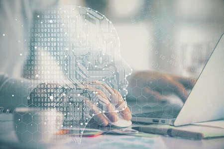 Man typing on keyboard background with brain hologram. Concept of big Data.の写真素材